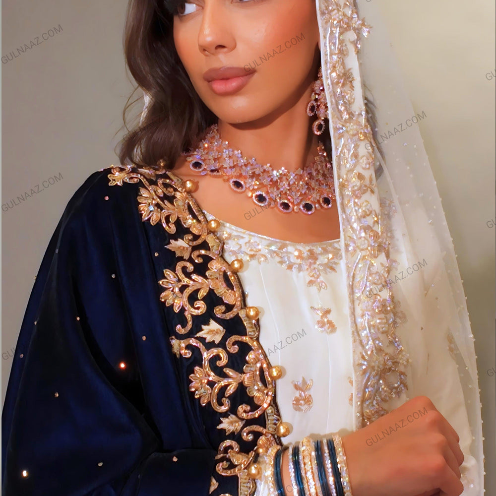 
                  
                    White lehenga with blue dupatta
                  
                