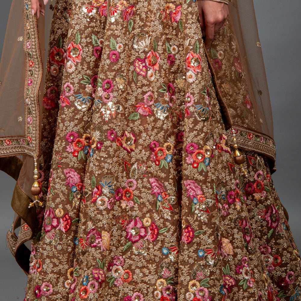 
                  
                    Close-up of floral embroidery and sequin work on Shehwar bridal gown fabric
                  
                