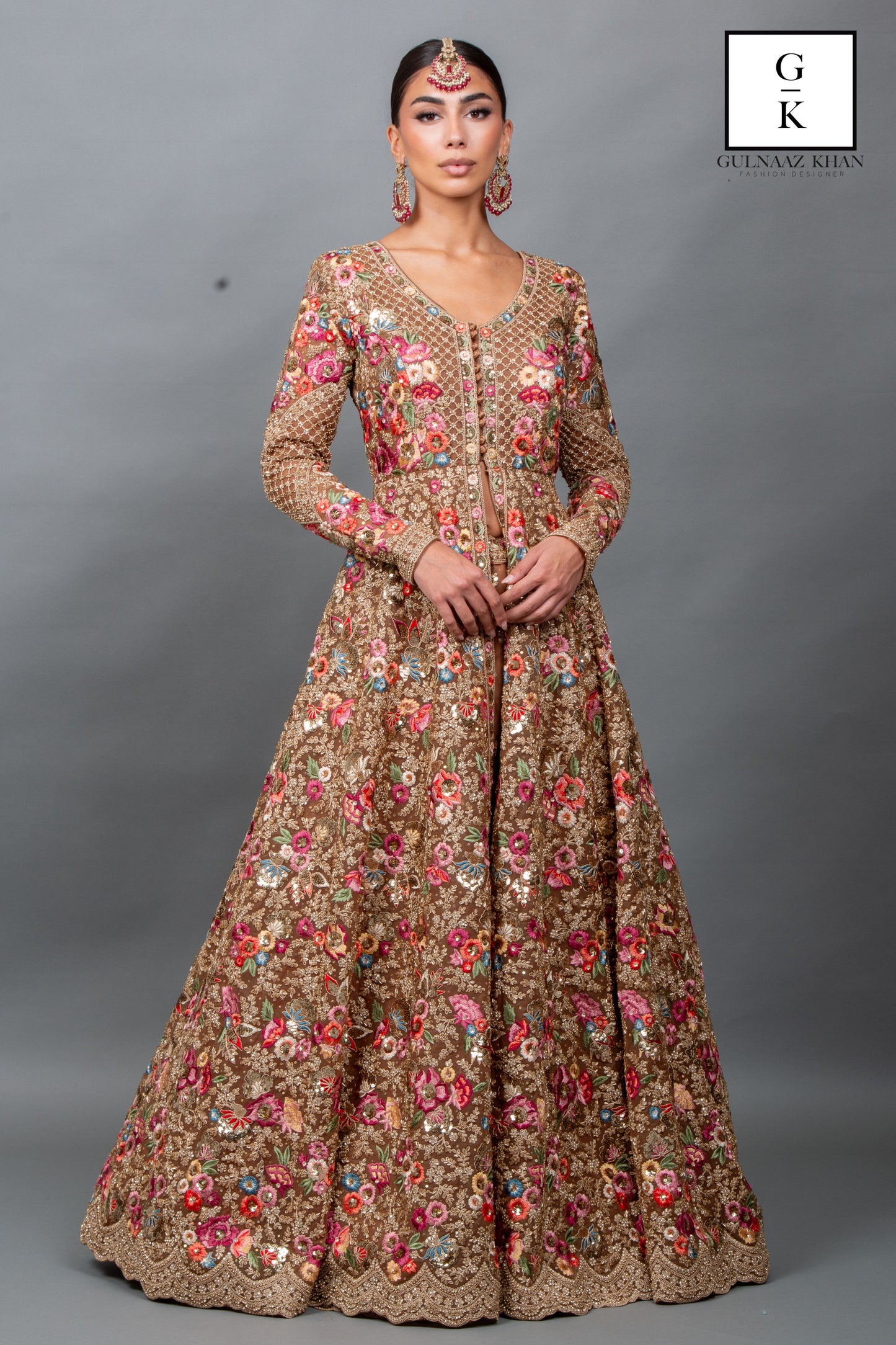 Shehwar bridal gown with full sleeves, V-neckline, and all-over floral embroidery