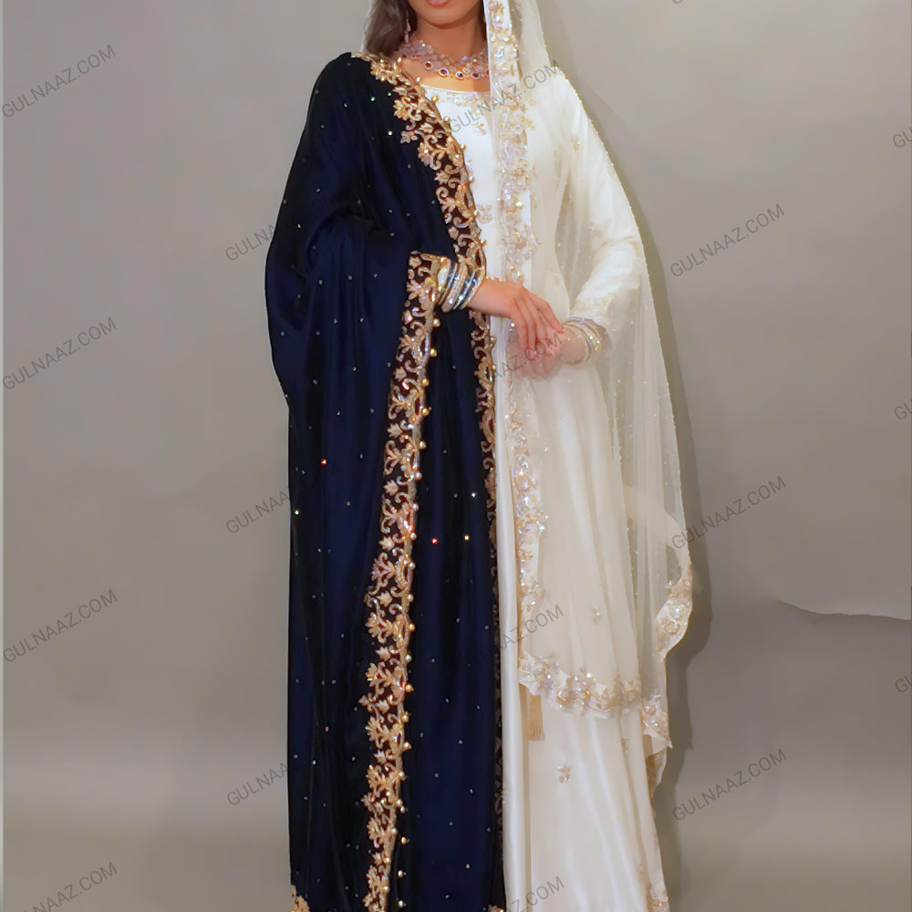 
                  
                    White gown with dark blue velvet dupatta
                  
                