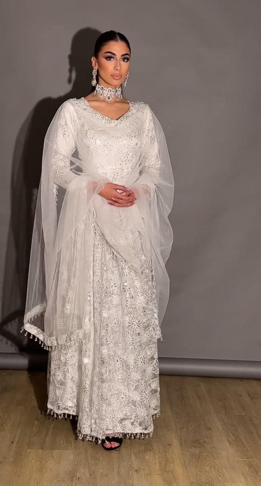 
                  
                    white net embroided gown
                  
                