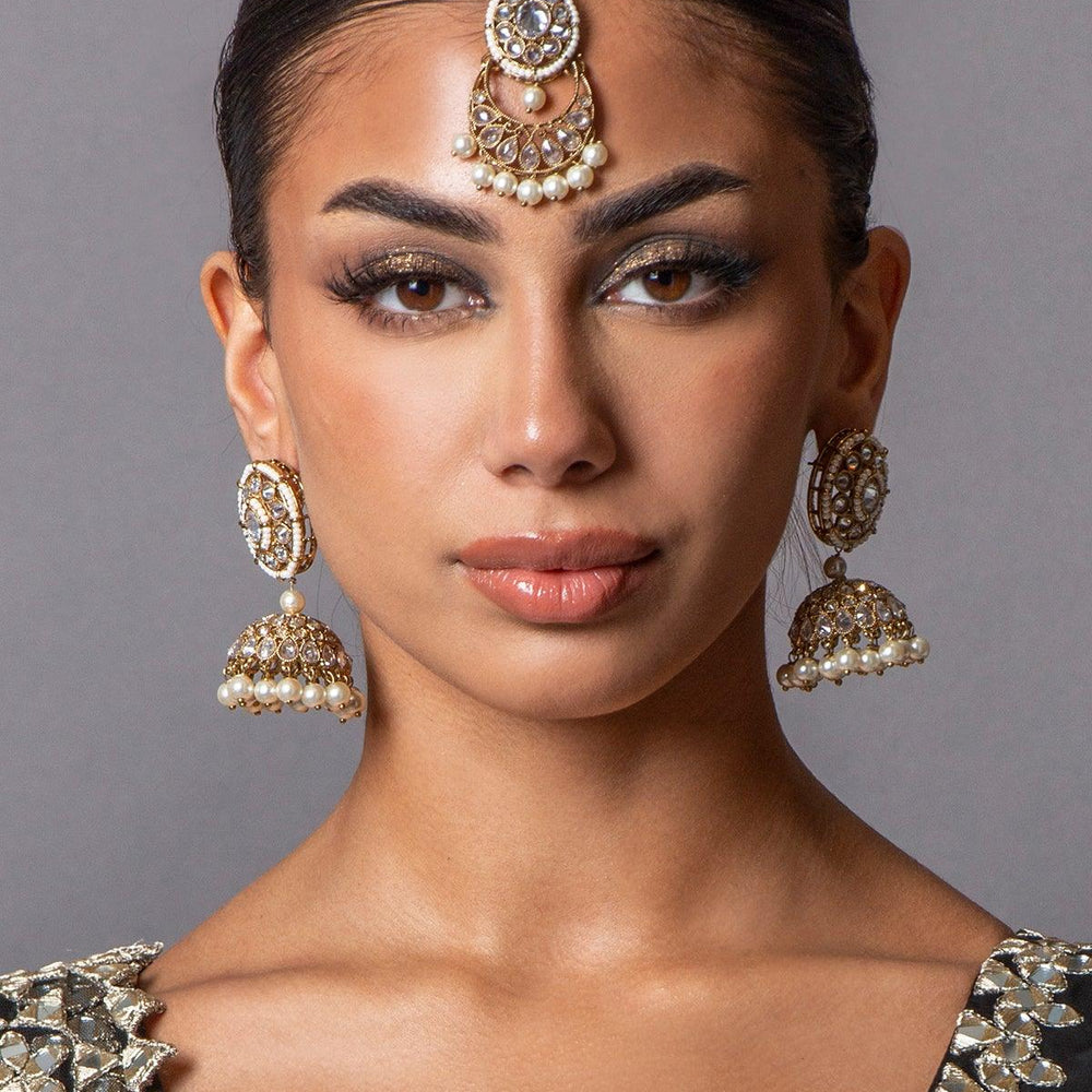 
                  
                    gold earrings and maang tikka
                  
                