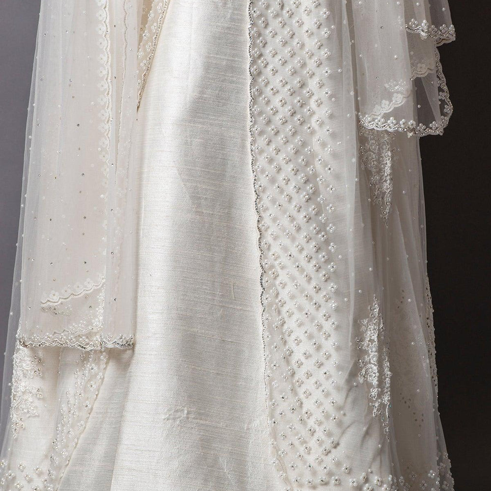 
                  
                    long white gown
                  
                
