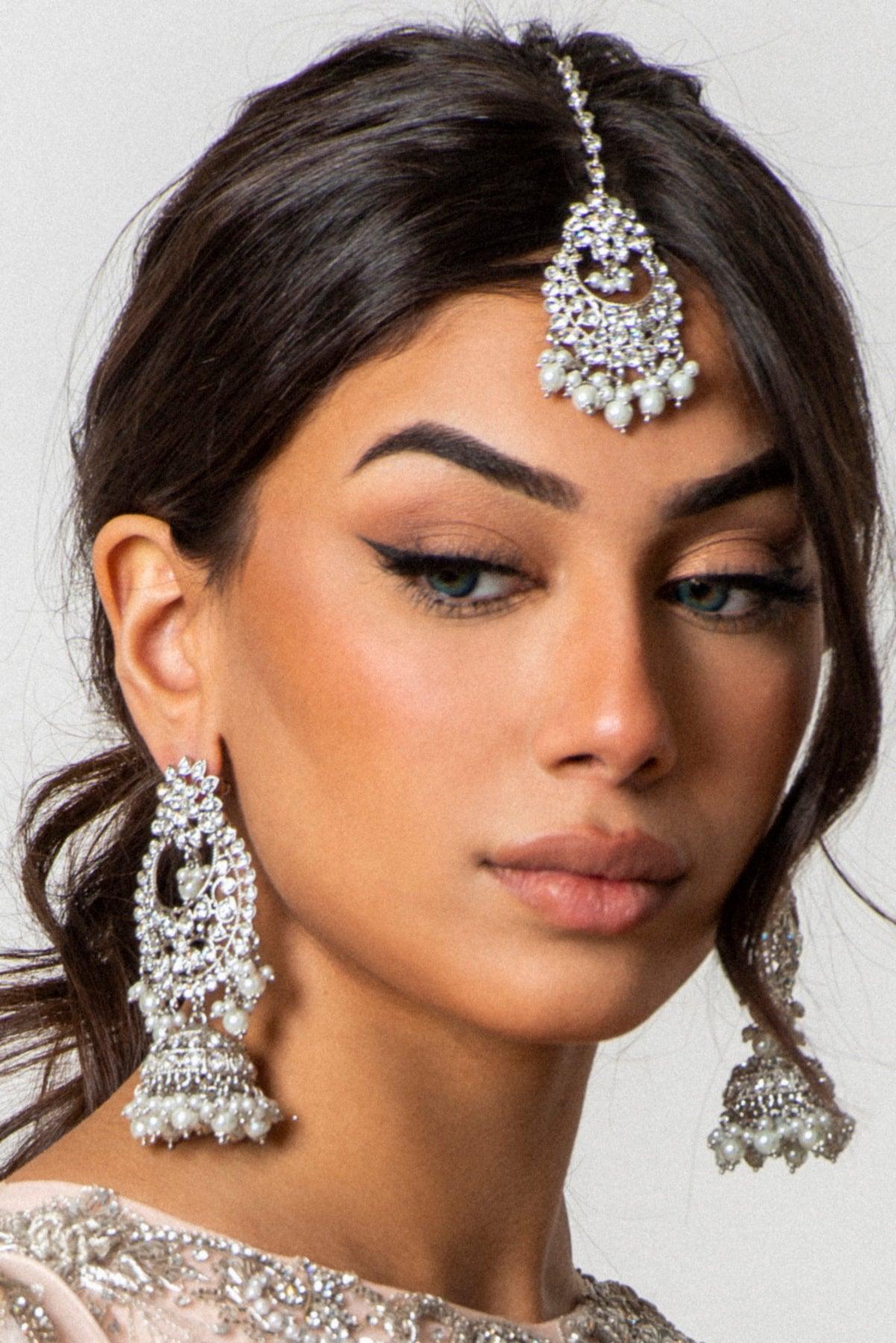 silver earrings and maang tikka