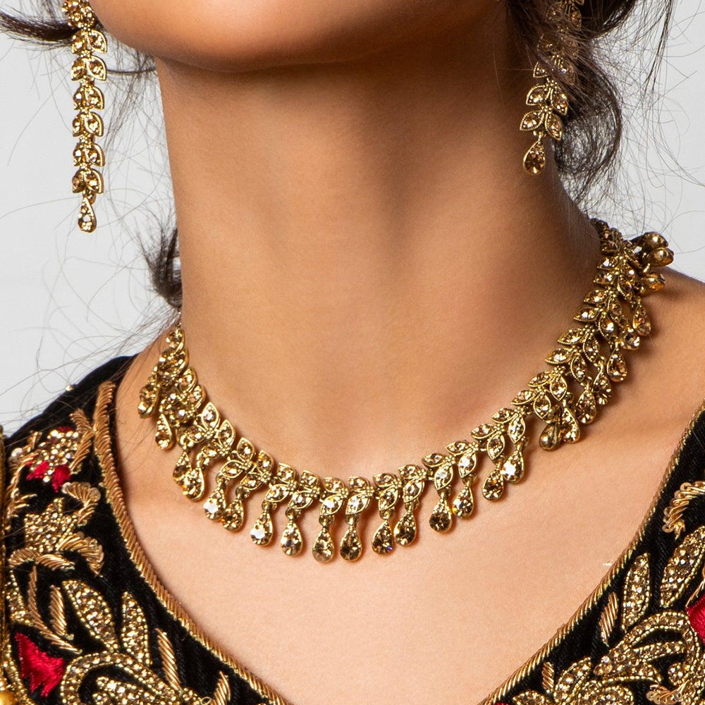 
                  
                    golden necklace and earrings set
                  
                