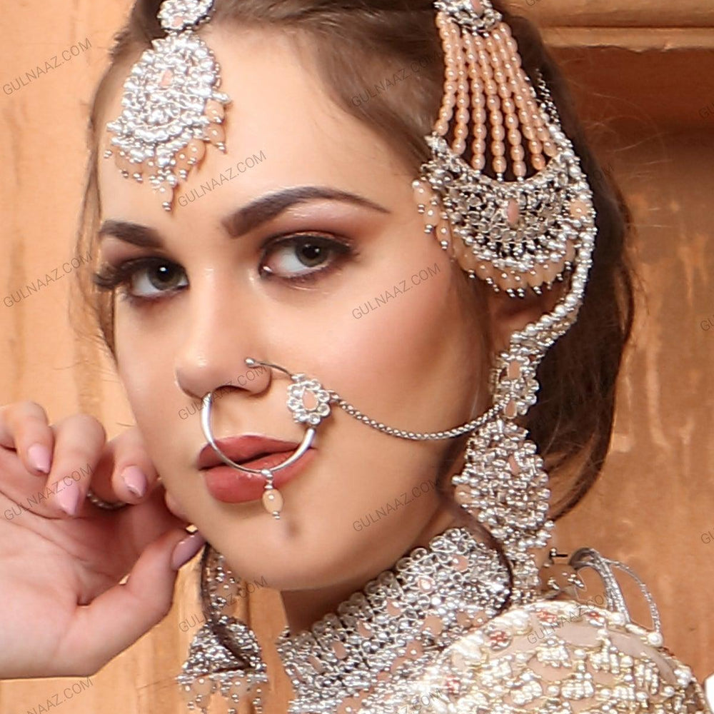 
                  
                    earrings, maang tikka and hand ring bracelet
                  
                